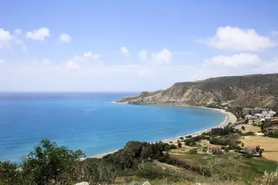 a view of the beach from a hill at Apokryfo, one bedroom apartment close to the beach in Pissouri