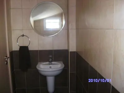 a bathroom with a sink and a mirror at Luxury Villa - Private Pool and Wifi Perfect location for a holiday in Protaras