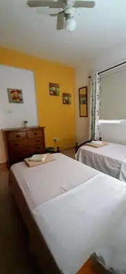 a bedroom with two beds and a window at SUNNY HOME in Protaras