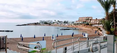 a view of a beach with buildings and the ocean at SUNNY HOME in Protaras