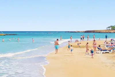 a group of people standing on a beach at Villa Anastasia - Fig Tree Bay Area in Protaras