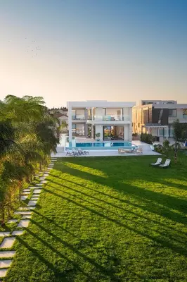 a house with a large yard with a swimming pool at Eros Cyprus in Ayia Napa