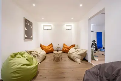 a living room with bean bags and a table at Eros Cyprus in Ayia Napa