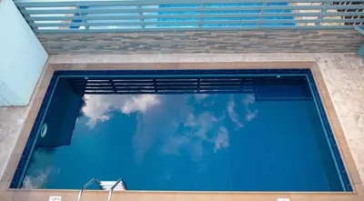 a reflection of the sky in a swimming pool at Villa Ruby Evelyn in Protaras