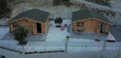 a model of a wooden house with a roof at Happy Glamping Cy in Ayios Theodhoros