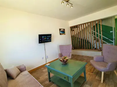 a living room with a couch and two chairs and a table at Leucolla Hill & Sea in Protaras