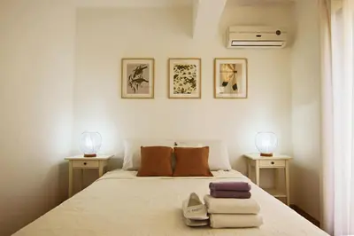 a bedroom with a bed with towels on it at Phaedrus Living Luxury Flat Protaras Sea View 9 in Protaras