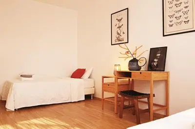 a room with a bed and a table with a chair at Phaedrus Living Luxury Flat Protaras Sea View 9 in Protaras