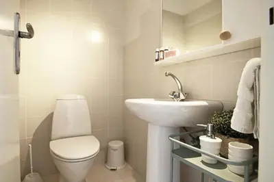 a bathroom with a white toilet and a sink at Phaedrus Living Luxury Flat Protaras Sea View 9 in Protaras