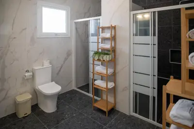 a bathroom with a toilet and a shower at Villa Ruby Nissi Beach in Ayia Napa