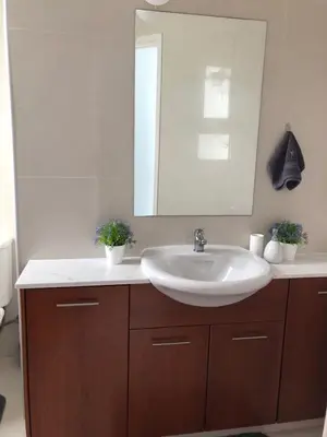 a bathroom with a sink and a mirror at Oasi Rejuve Poseidon in Meneou