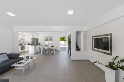a living room with a couch and a table at Villa Alleli in Protaras