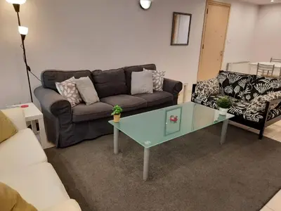 a living room with a couch and a coffee table at 3 Bedroom Apartment in Nicosia