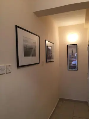 a hallway with three pictures on the wall at Holidays in Cyprus in Ayia Napa