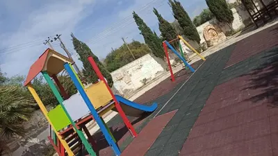 a group of colorful playground equipment on a roof at Holidays in Cyprus in Ayia Napa
