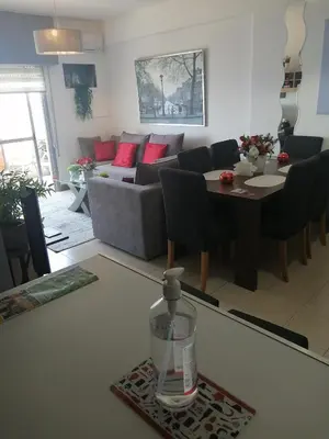 a living room with a couch and a table at Amazing Sea Place in Limassol