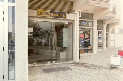 a store front of a store with glass windows at Furnished Seafront Studio in Larnaka