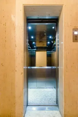 an empty elevator in a room with a wall at Furnished Seafront Studio in Larnaka