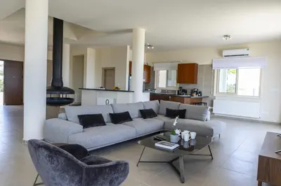 a living room with a couch and a table at Villa Elite in Protaras