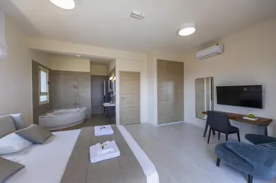 a living room with a couch and a bathroom at Villa Elite in Protaras
