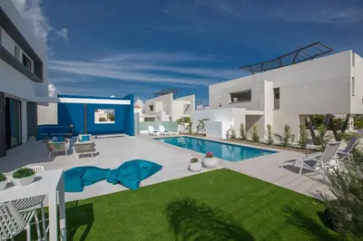 a villa with a swimming pool and a yard at Ocean 11 Villa in Protaras
