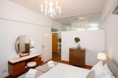 a bedroom with a bed and a mirror at 1-80 Collection by TrulyCyprus in Limassol