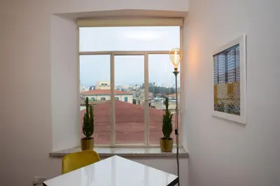 a window in a room with a table and a view at 1-80 Collection by TrulyCyprus in Limassol