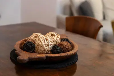 a wooden bowl filled with noodles on a table at 1-80 Collection by TrulyCyprus in Limassol