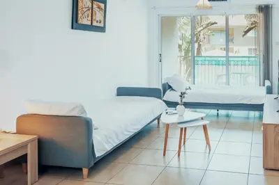 a bedroom with a bed and a couch and a table at Elegant 1 Bedroom Apartment - Great Kings Resort Protaras, Kapparis in Paralimni