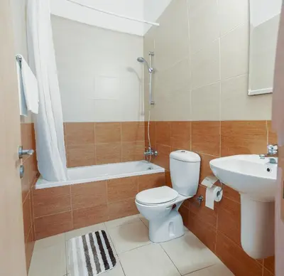 a bathroom with a toilet and a sink at Elegant 1 Bedroom Apartment - Great Kings Resort Protaras, Kapparis in Paralimni