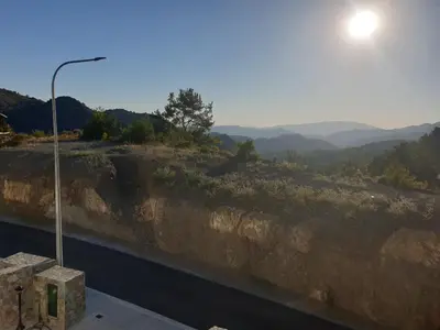 a street light on top of a hill with a view at Melissonas Villas in Phini