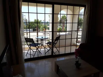 a view of a balcony with a table and chairs at La Veranda Sea View apartments in Larnaka