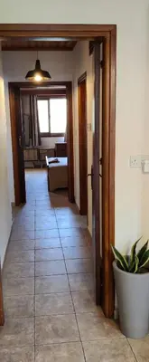 a hallway with a door leading to a living room at Το Σπίτι του Προκόπη in Nicosia