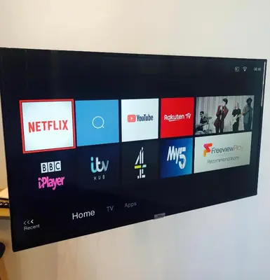 a television screen with many different logos on it at Angel Suites in Nicosia