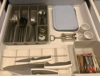 a drawer filled with utensils and a knife and fork at Angel Suites in Nicosia