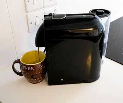 a coffee maker and a cup of coffee on a counter at Glabur Stays - The Amazing 1 BDR - Executive apt Nicosia Center Free Parking & WiFi in Nicosia