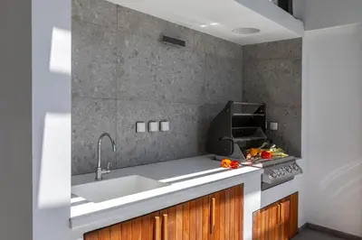 a kitchen with a sink and a stove at Chris Le Mare Gold Luxury Villa in Protaras
