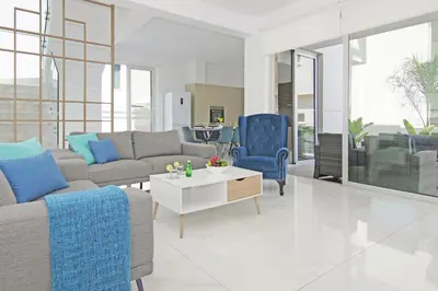 a living room with a couch and a table at Villa Greta in Protaras