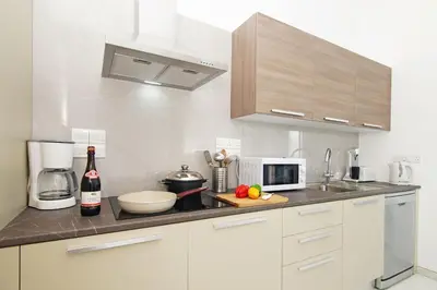 a kitchen with a counter top with a microwave at Villa Greta in Protaras
