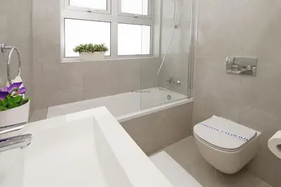a bathroom with a toilet and a sink and a tub at Villa Luna in Protaras