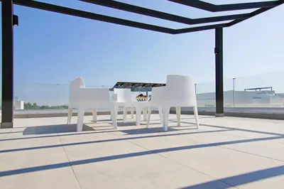 a white table and chairs on a patio at Villa Luna in Protaras