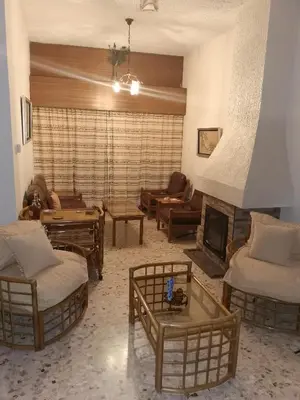 a living room filled with furniture and a fireplace at Kakopetria Heights in Kakopetria