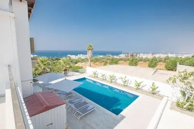 a villa with a swimming pool and a view of the ocean at Villa Nepou - Beautiful 4 Bedroom Villa - Located In Ayia Napa in Ayia Napa