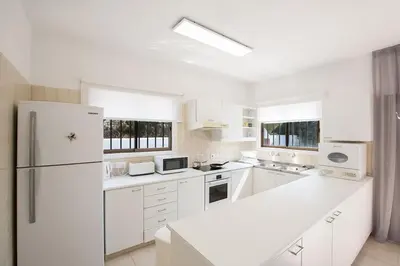 a kitchen with white appliances and a white refrigerator at Villa Nepou - Beautiful 4 Bedroom Villa - Located In Ayia Napa in Ayia Napa