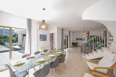 a dining room with a table and chairs at Villa Nepou - Beautiful 4 Bedroom Villa - Located In Ayia Napa in Ayia Napa