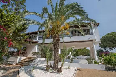 a palm tree in front of a building at Villa Nepou - Beautiful 4 Bedroom Villa - Located In Ayia Napa in Ayia Napa