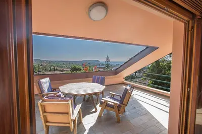 a patio with a table and chairs on a balcony at Villa Ayia Napa Foothills, Exquisite 5Bdr Ayia Napa Villa With Pool in Ayia Napa