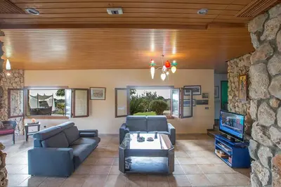 a living room with a couch and a tv at Villa Ayia Napa Foothills, Exquisite 5Bdr Ayia Napa Villa With Pool in Ayia Napa