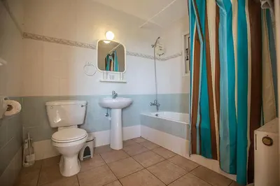 a bathroom with a toilet and a sink and a tub at Villa Magusta - Modern 4 Bedroom Ayia Thekla Villa With Pool in Ayia Napa