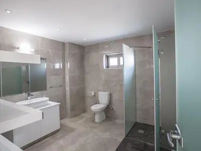 a bathroom with a toilet and a sink and a shower at Villa Ioanni Chrysos - Luxury And New 6 Bedroom Protaras Villa in Protaras